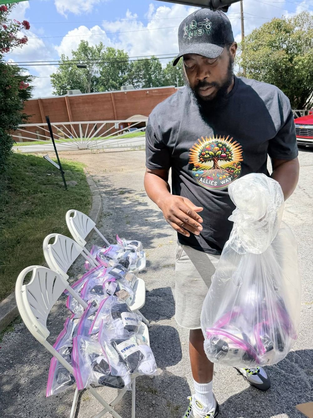 Allies Way volunteer with care bags