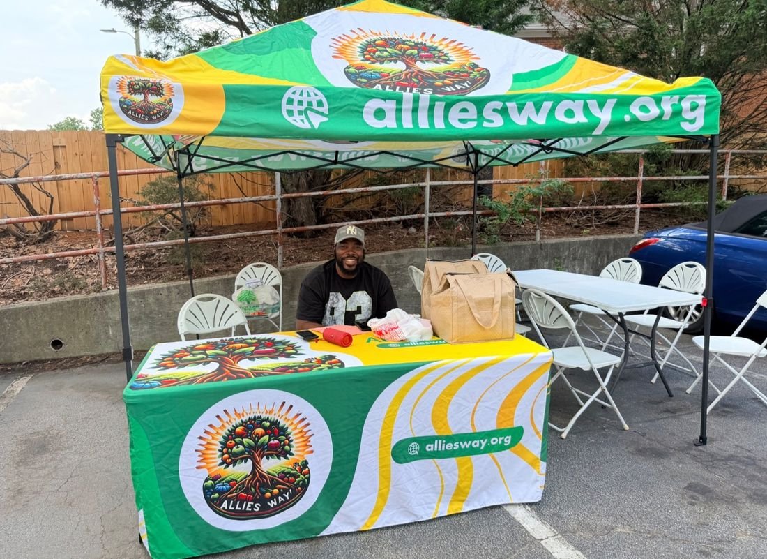Allies Way volunteer at the Allies Way tent